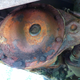 A rusty Dana 35 rear axle.